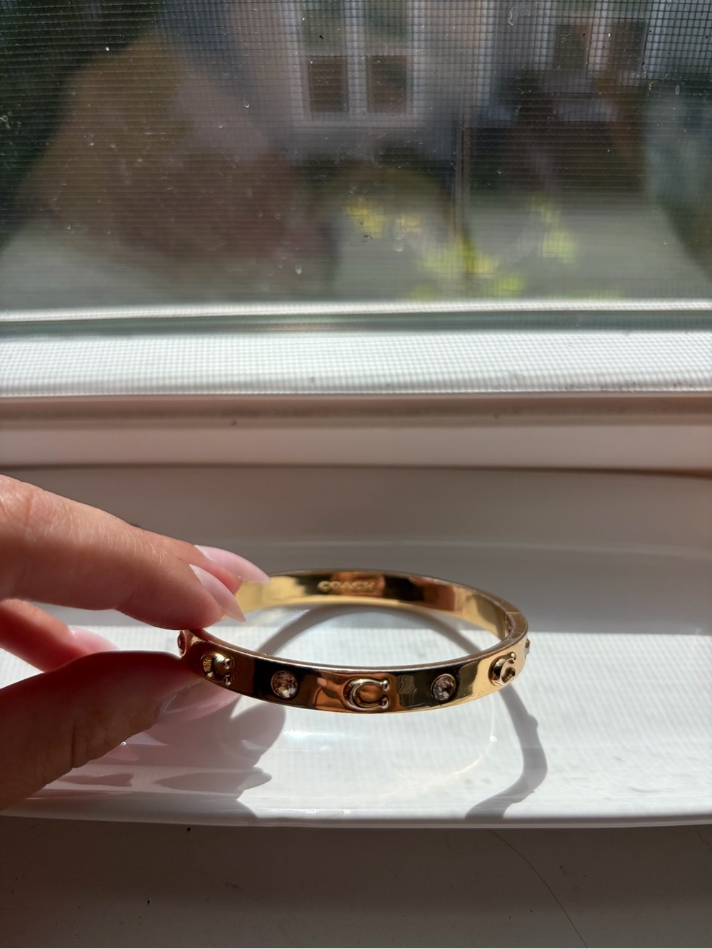 Coach Gold-tone Crystal Logo Hinged Bangle Bracelet